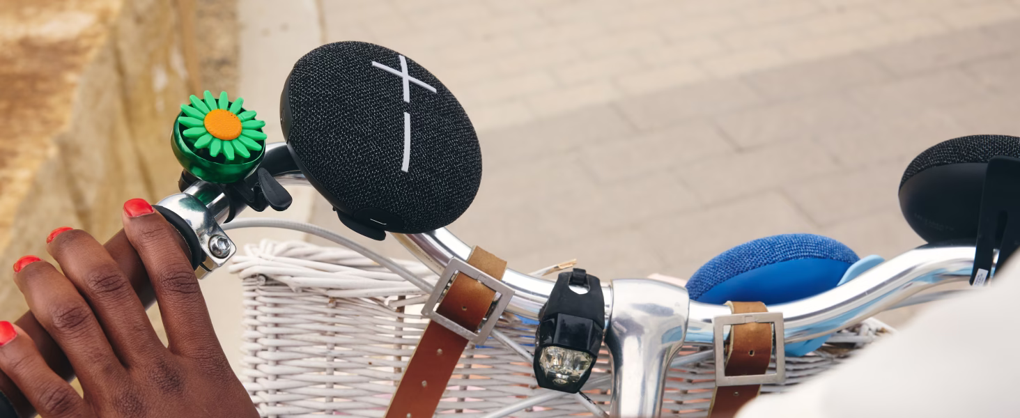 Ultimate Ears MINIROLL ultra-portable design with adjustable strap and PartyUp Auracast multi-speaker pairing